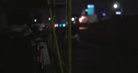 Young man breaks into Construction site Stock Footage 87722570