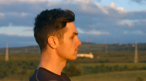 Young man breathing in the sunset Stock Footage 64013290