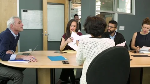 Young man bringing coffee to his co-workers Stock-Footage 77080230