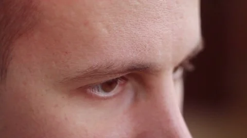 A young man with brown eyes looking to the side ,a computer effect Stock Footage 75458631