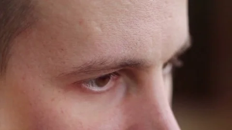 A young man with brown eyes looking to the side ,a computer effect Stock Footage 75458763