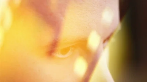 A young man with brown eyes looking to the side ,a computer effect Stock Footage 75459043