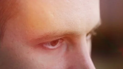 A young man with brown eyes looking to the side ,a computer effect Stock Footage 75459321