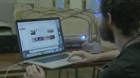 Young Man Browsing the Internet on Laptop Computer Stock Footage 341863098