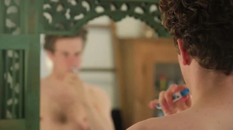 Young man brushing teeth Stock Footage 40844031