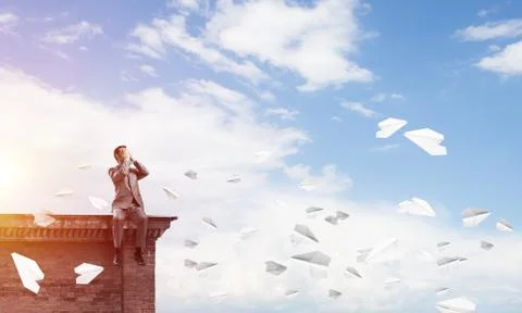 Young man on building edge do not want to see anything Stock Photos