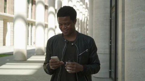 Young man busy text messaging Stock Footage 90567241