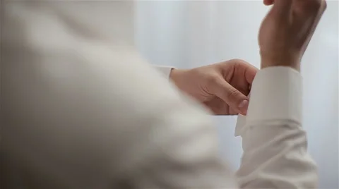 Young man buttons shirt button. Young bride dress and shirt buttons. 스톡 동영상 64840226
