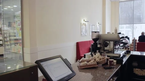 Young man buys something at checkout. Coffee bar оr shop Vídeos de archivo 49891563