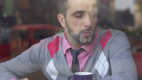 A young man in a cafe tells another man about a creative project Stock-Footage 85223633