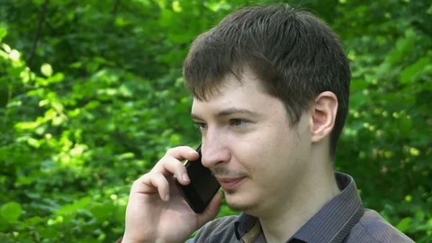 Young Man Call Using Cell Smart Phone Smiling Outdoors Handsome Guy Talking Stock Footage 77149679