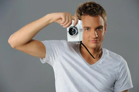 Young man with a camera Foto stock
