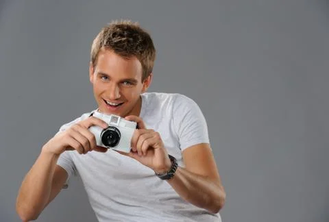 Young man with a camera Fotos Stock
