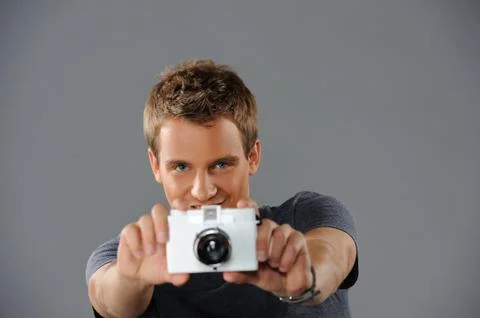 Young man with a camera Foto stock