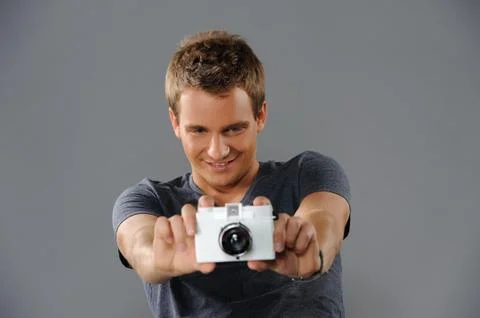 Young man with a camera Foto stock