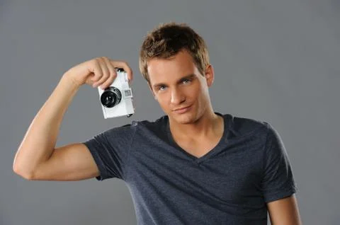 Young man with a camera Fotos Stock