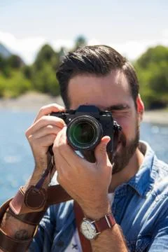Young man with a camera Stock Photos