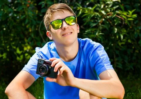Young Man with a Camera Stock Photos