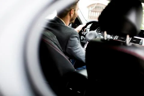 Young man in the car Stock Photos