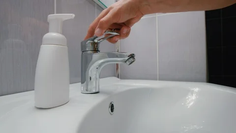 Young Man Carefully Washes Hands With Liquid Soap Stock Footage 127674871