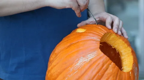 Young man carving pumpkin Stock Footage 42984362
