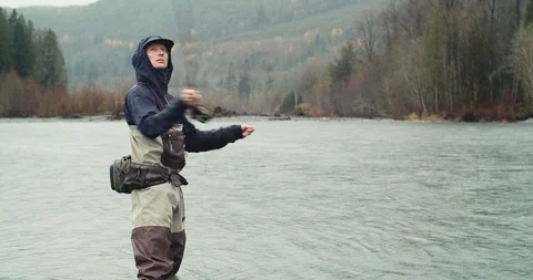 Young man casts his fly fishing line Stock Footage 102188240