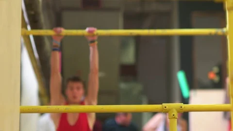 Young Man Catching on to the Bar Stock Footage 70525321