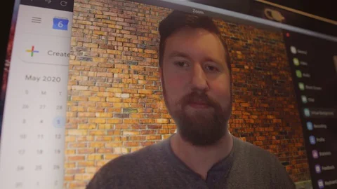 Young man changes video conference call background 스톡 동영상 129853536