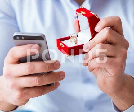 Young man chatting with his sweetheart over mobile phone Stock Photos