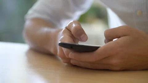 Young man chatting on smartphone Stock Footage 106294549