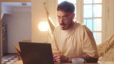 Young Man Chatting on Video Call on Laptop at Home Stock Footage 265049136