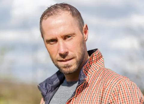 Young man with checkered jacket portrait Stock Photos
