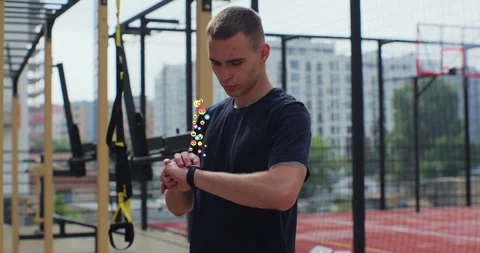 Young man checking incoming notification on smart watch. Animation of social Stock Footage 246700226