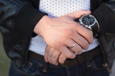 Young man checking time Stock Photos