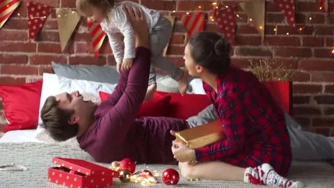 Young the man cheerfully plays with the small daughter. Stock Footage 69249047