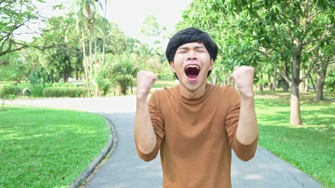 Young man cheering at camera. Stock Footage 92288827