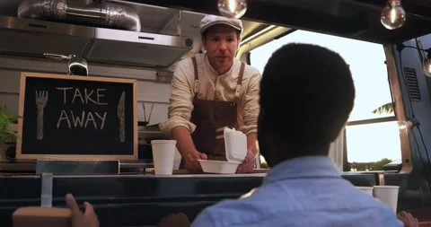 Young man chef working inside food truck preparing dinner food Stock Footage 156454632