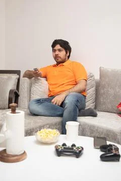 Young Man Chilling on Sofa Stock-Fotos