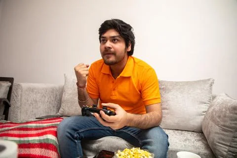 Young Man Chilling on Sofa Stock-Fotos