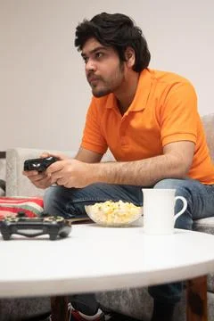 Young Man Chilling on Sofa Stock-Fotos