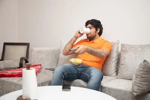 Young Man Chilling on Sofa Stock-Fotos