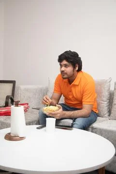 Young Man Chilling on Sofa Stock-Fotos
