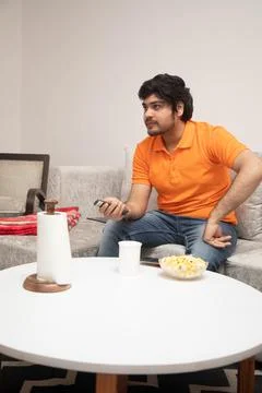 Young Man Chilling on Sofa Stock-Fotos