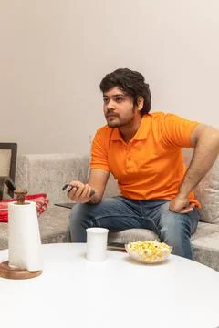 Young Man Chilling on Sofa Stock-Fotos