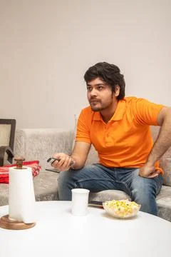 Young Man Chilling on Sofa Stock-Fotos