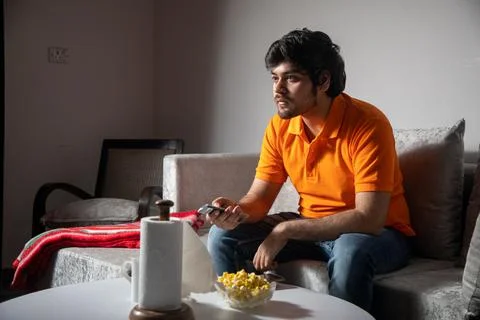 Young Man Chilling on Sofa Stock-Fotos