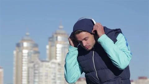 The young man chooses to jogging track Stock-Footage 252675783