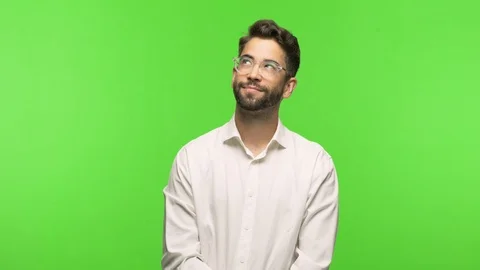 Young man on chroma dreams of achieving goals and purposes Stock Footage 97589079