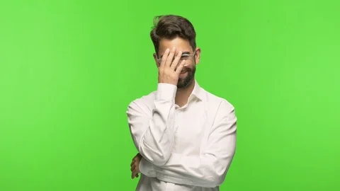 Young man on chroma embarrassed but laughing Video stock 97588943