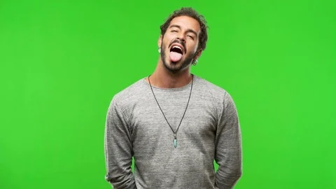 Young man on chroma green screen funnny and friendly Stock Footage 97706287